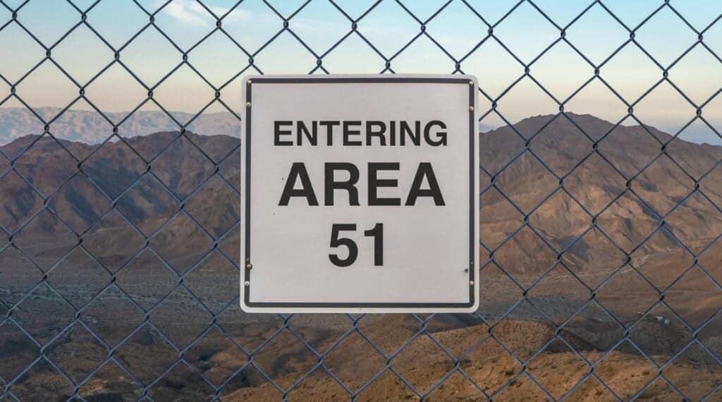 Conspiracy Theory Gift Ideas featured image of an Area 51 sign