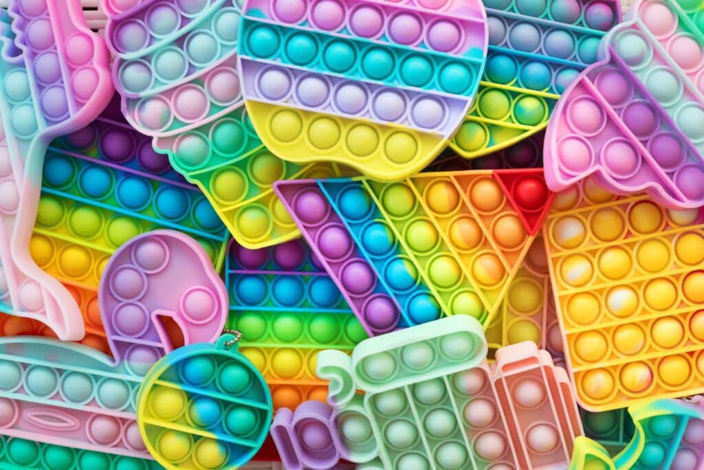 Pop it Birthday Party Ideas featured image of a bunch of pop it toys