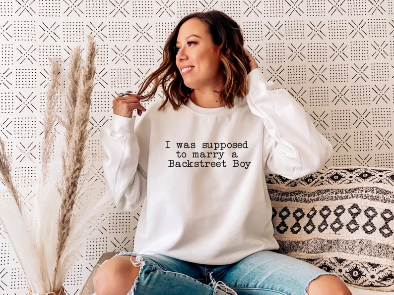 90s sweatshirt that says "I was supposed to marry a backstreet boy"
