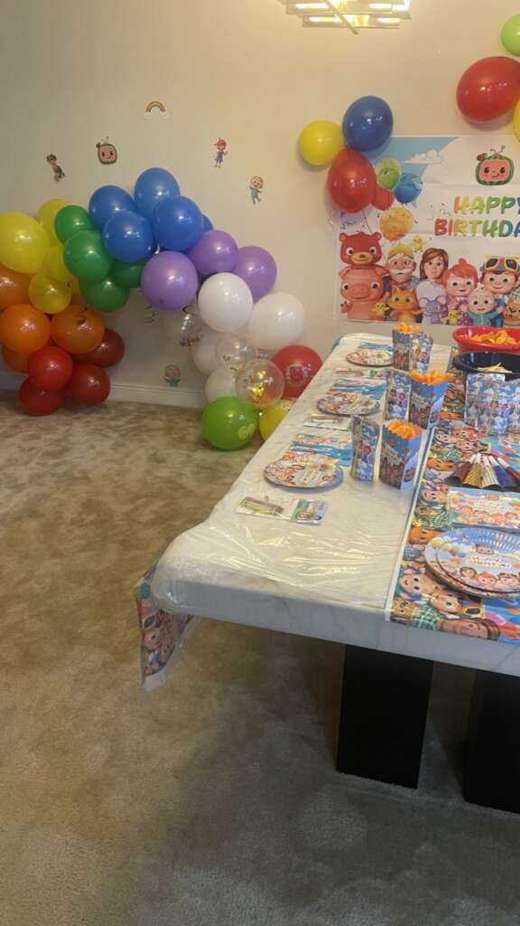 Cocomelon themed birthday party with decorations and balloons