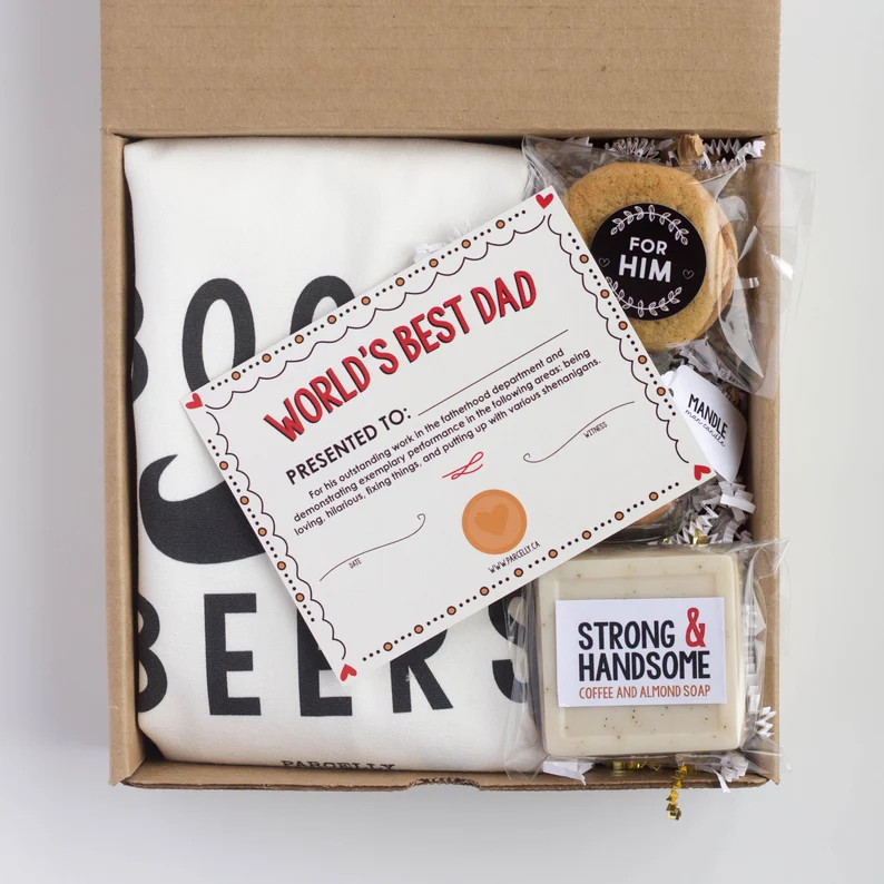 Parcel with a t-shirt, soap, and certificate that says world's best dad