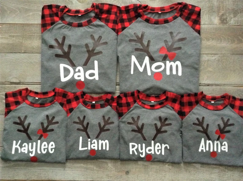 Buffalo plaid sleeves with grey base t-shirts with reindeer horn and family names below 