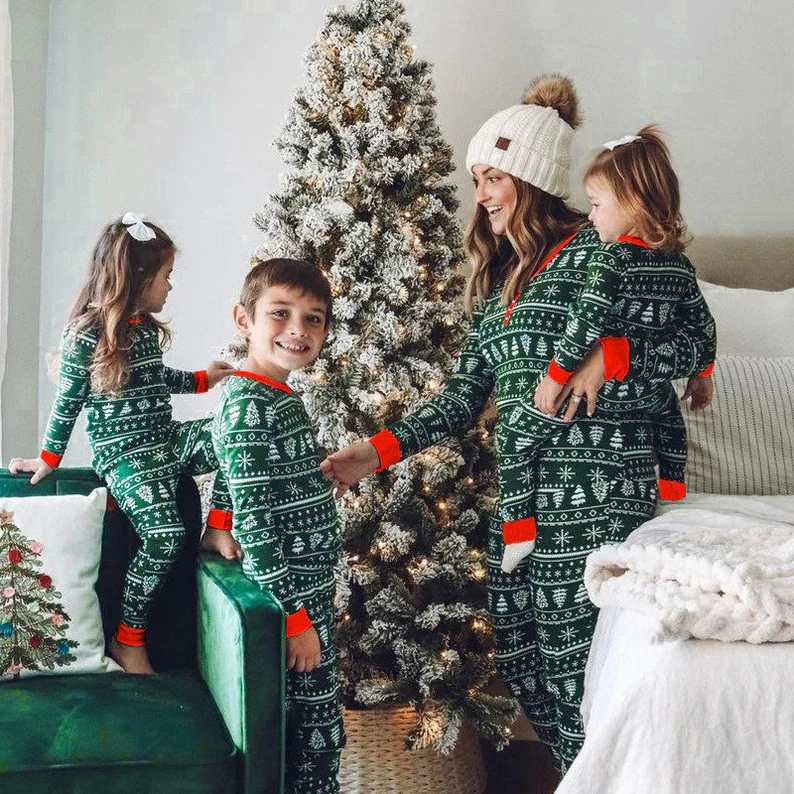 green with white printed Christmas designs with red cuff family pjs for Christmas