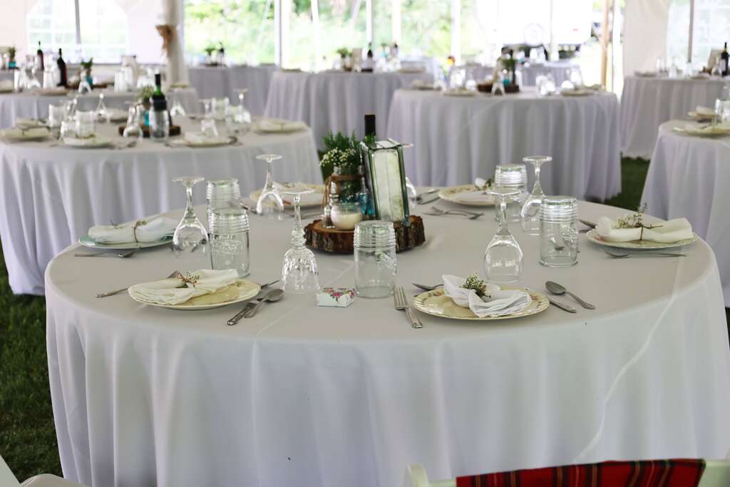 Table setting with a flower vase and baby's breath - How to Save Money on Flowers for a Wedding