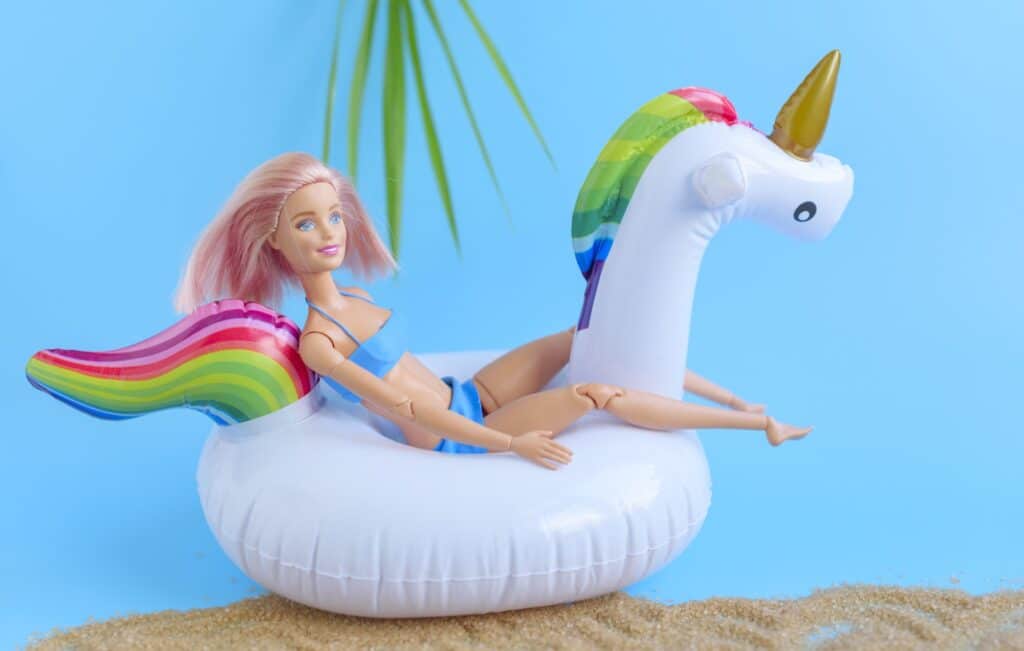 Barbie doll riding a unicorn inflatable
