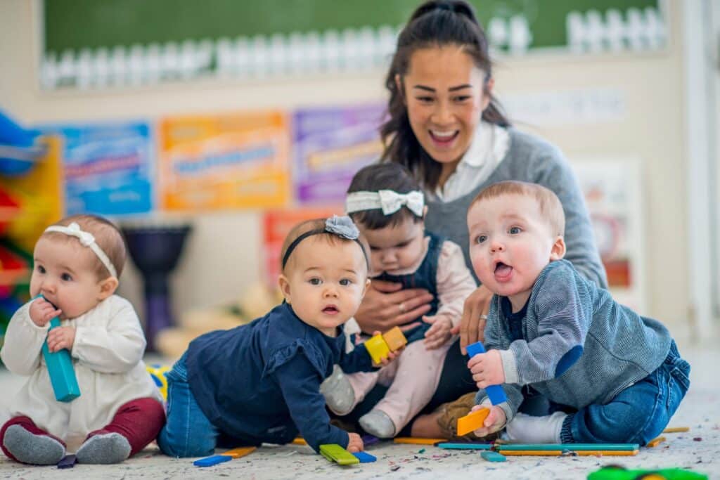 Daycare teacher with babies
