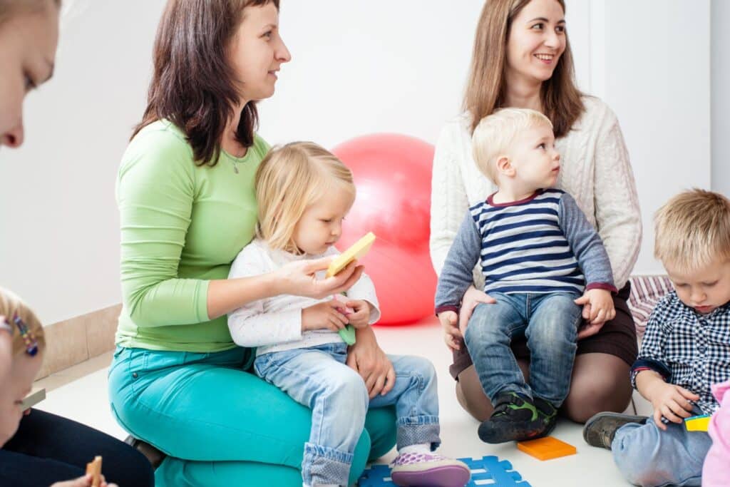 Group of new moms attending a mommy and me class to make friends