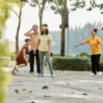 Big family playing hide and seek game in city park