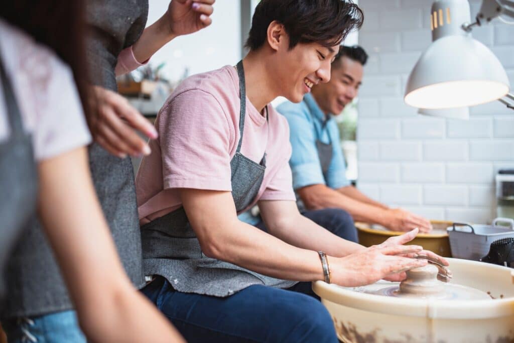 Young men in a pottery class
